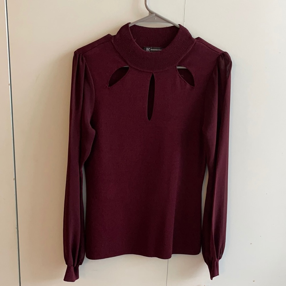 INC top with cut outs and sheer sleeves.